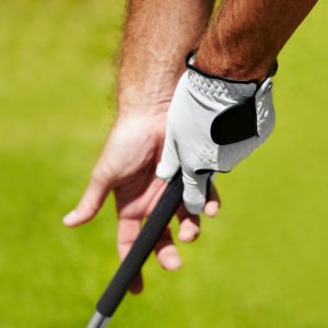 The proper grip is important. Cropped image of a golfer demonstrating the proper grip.