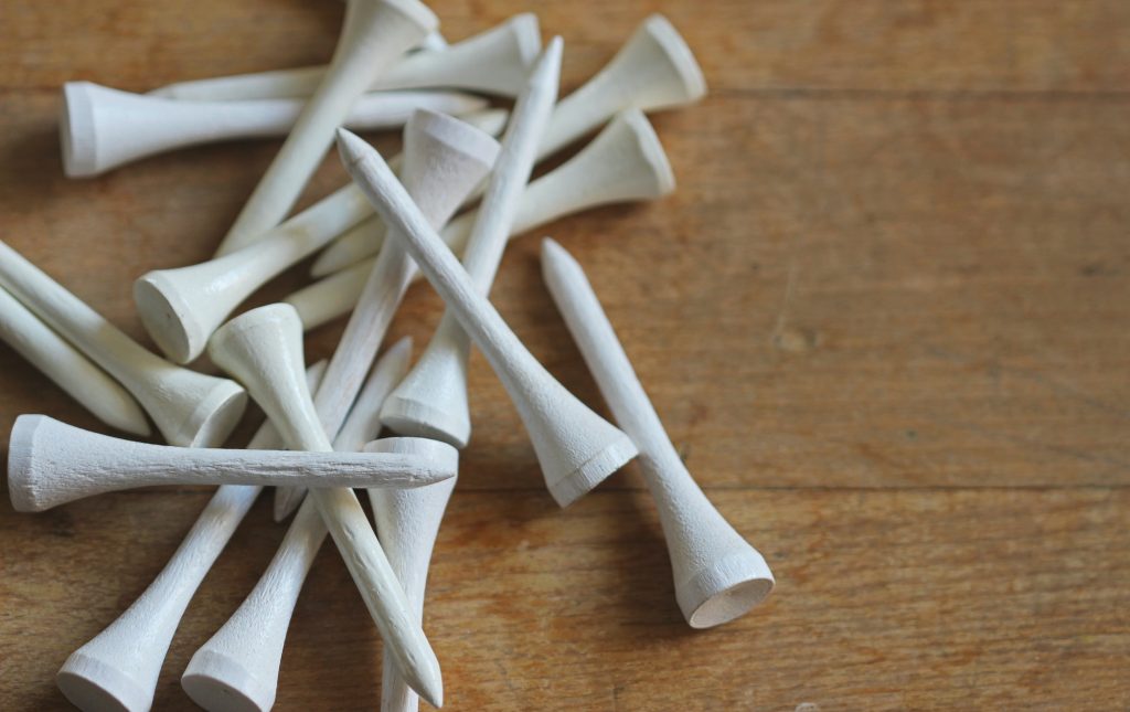 White gold tees on wood